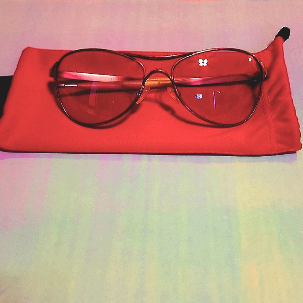 Genuine Women's Oakley sunglasses with pink frames and lenses.